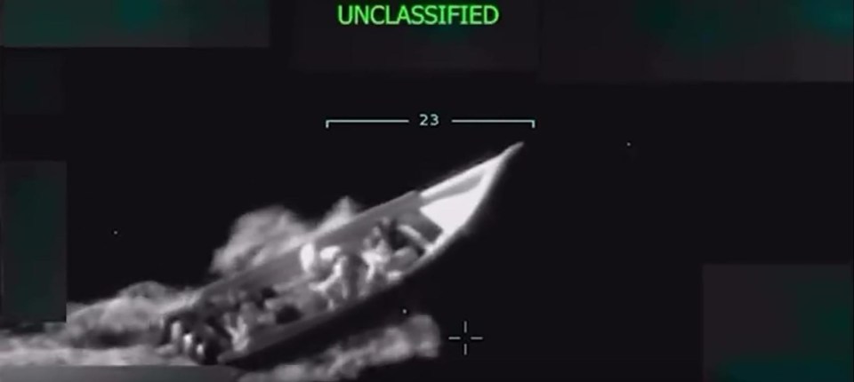 Night vision footage of a boat at sea.