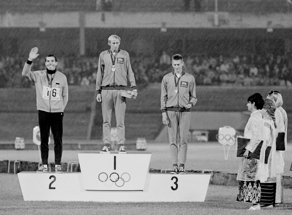 Black and white photo of the 1968 Olympic Games 400m hurdles medal ceremony.