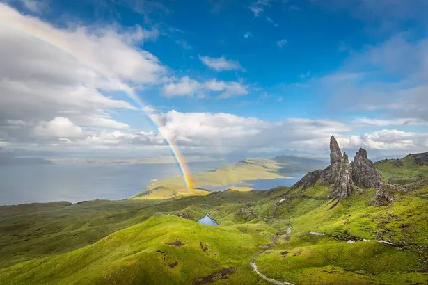 Rainbow and dramatic cloudscape over the Old Man of Storr, Skye, Scotland