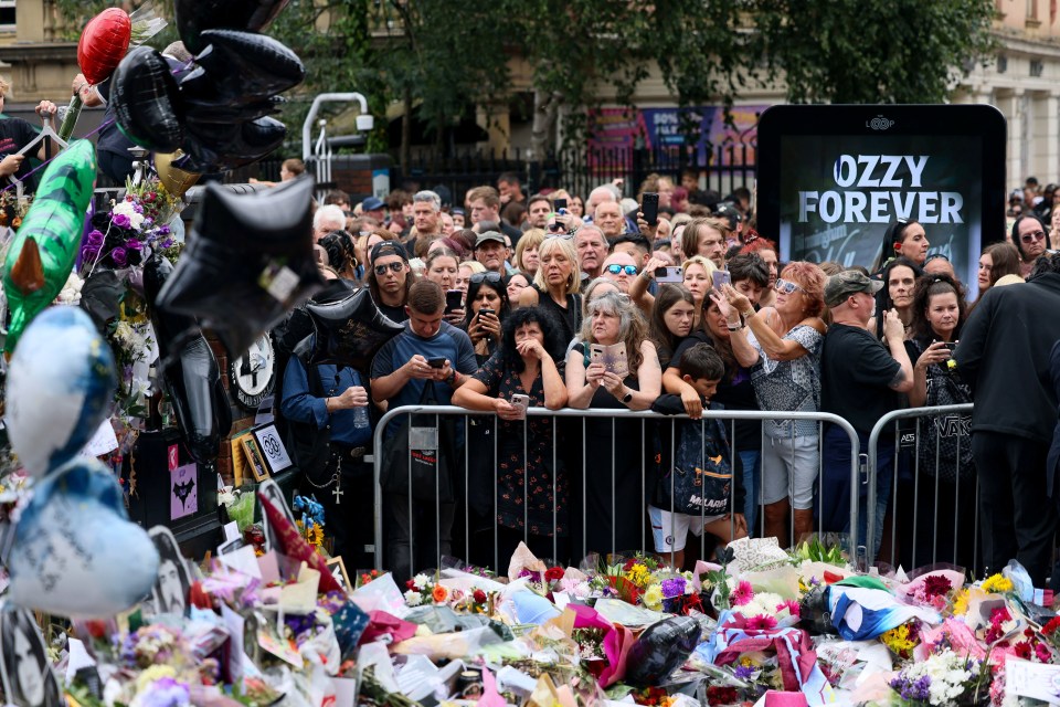 Mourners gather at a memorial for Ozzy Osbourne.