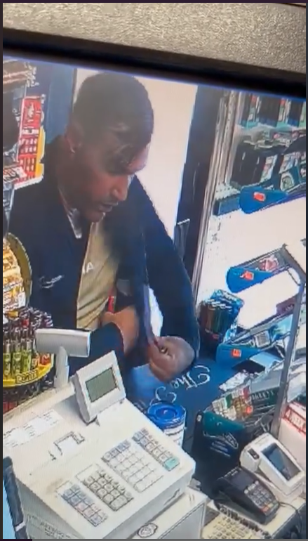 CCTV image of a man stealing a Poppy Appeal charity box.