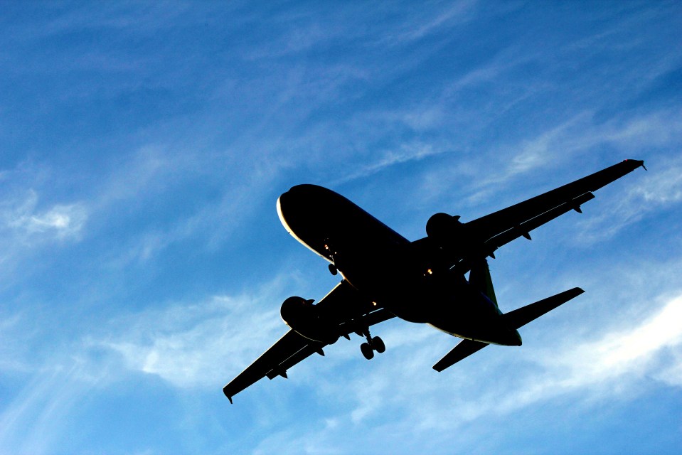Silhouette of an airplane in flight.