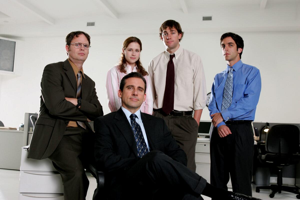 Members of "The Office" cast pose for a promotional shot