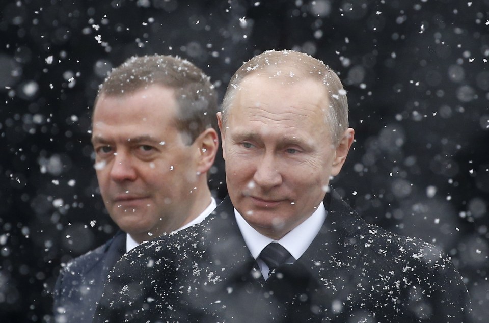 Vladimir Putin and Dmitry Medvedev in the snow.
