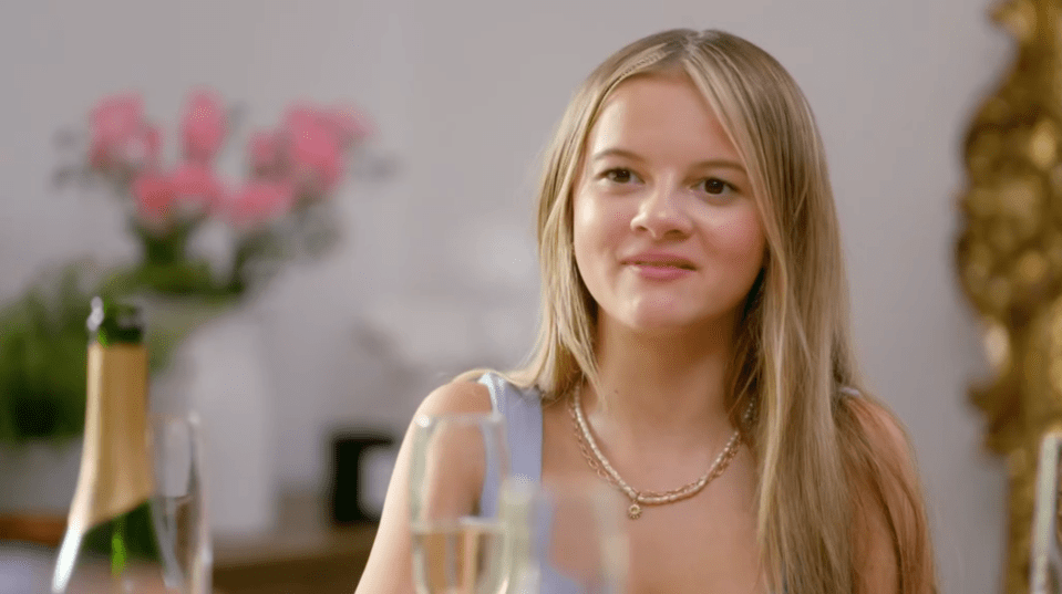 Young woman smiling at the camera.