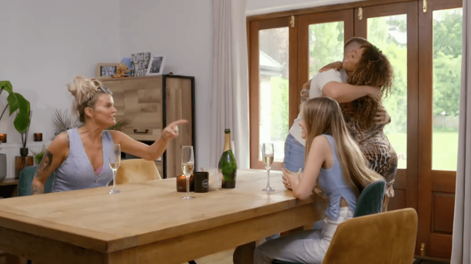 Screenshot of a woman arguing with a couple embracing.