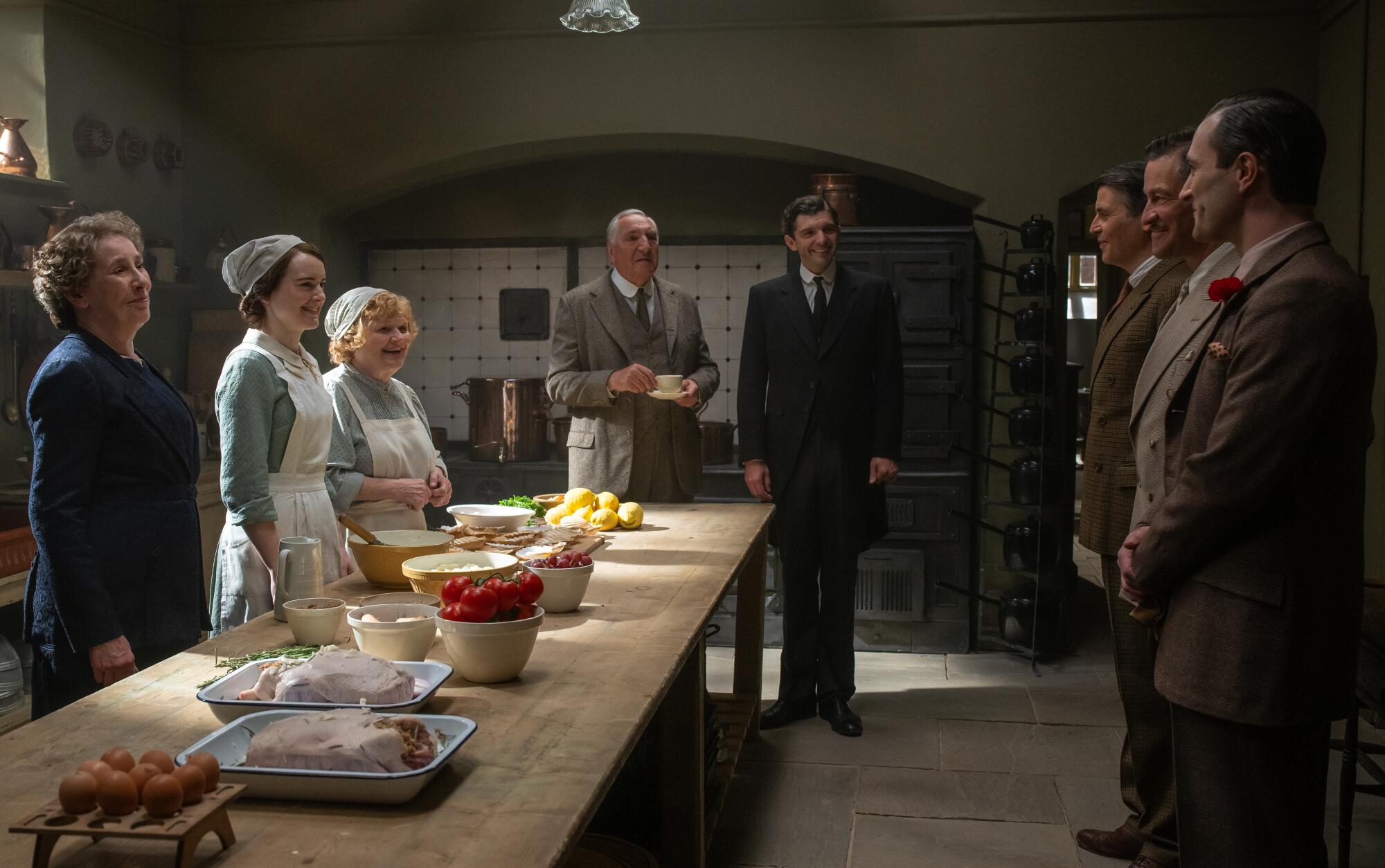 Downton's kitchen staff meets with guests.
