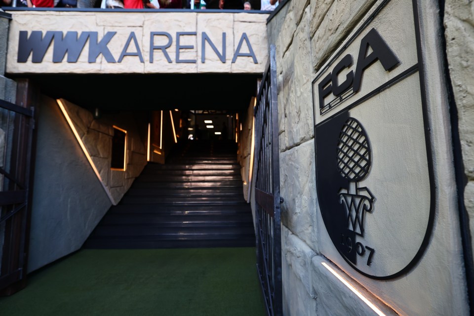 FC Augsburg's WWK Arena entrance with team logo.