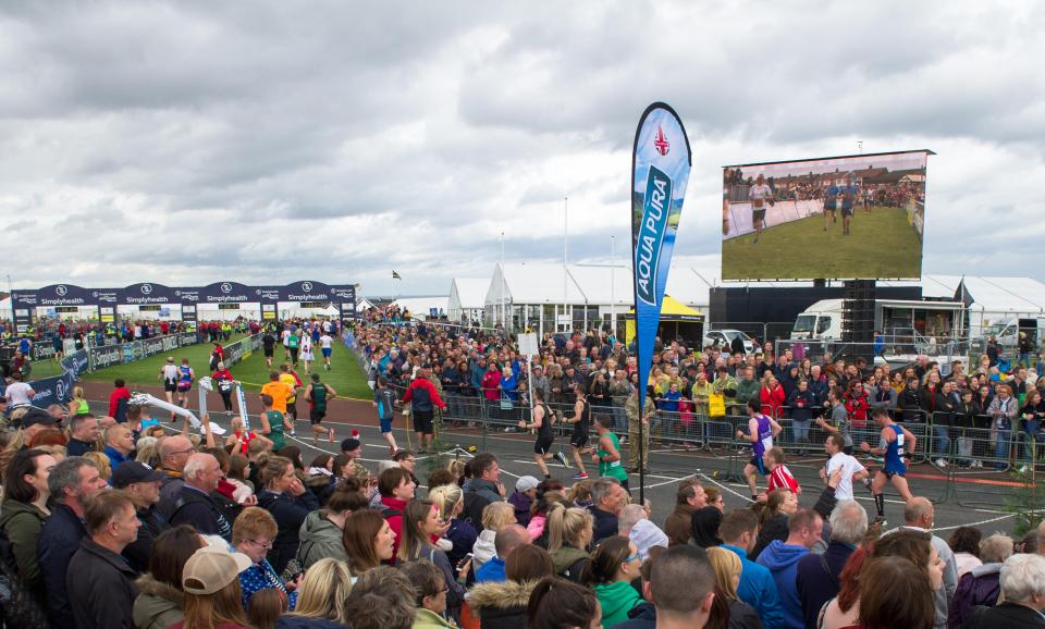 Crowd at a race finish line.