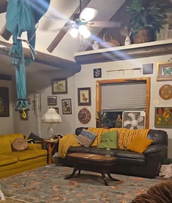 Living room with a hidden toy room behind the couch.