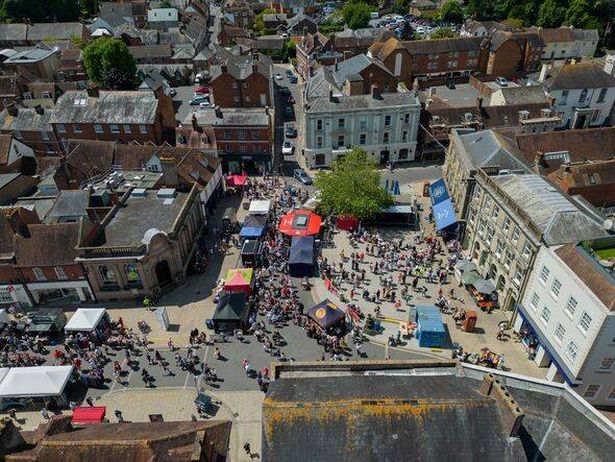 Wimborne Minster Folk Festival aerial view of the town square with people