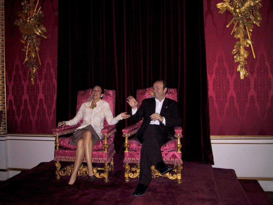 Ghislaine Maxwell and Kevin Spacey seated on thrones at Buckingham Palace.