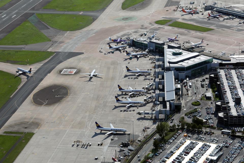 Aerial view of Manchester Airport Terminal 3 with airplanes parked at gates.