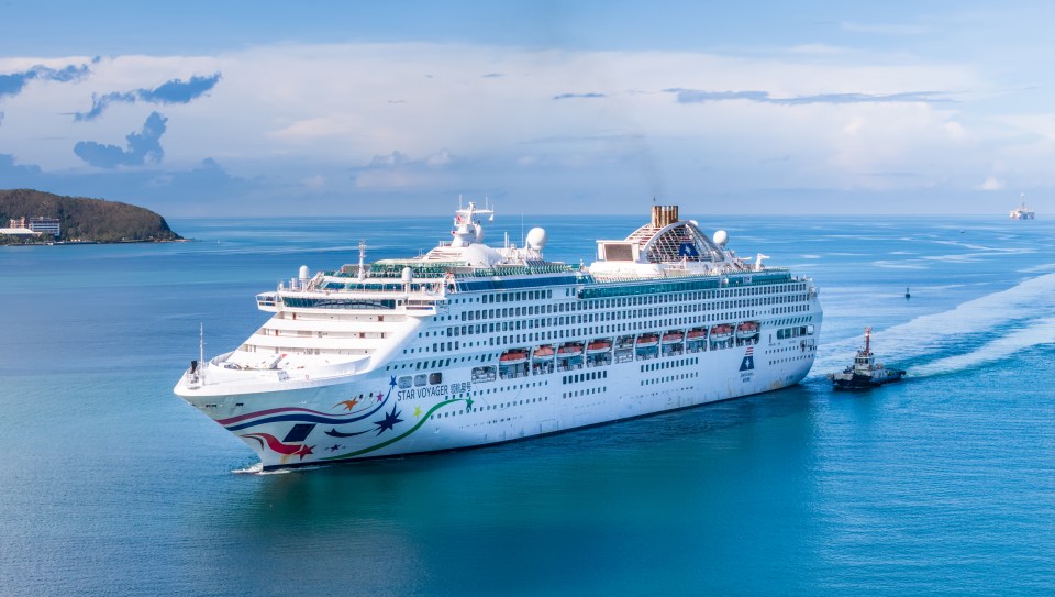 Aerial view of the Star Voyager cruise ship sailing into port.