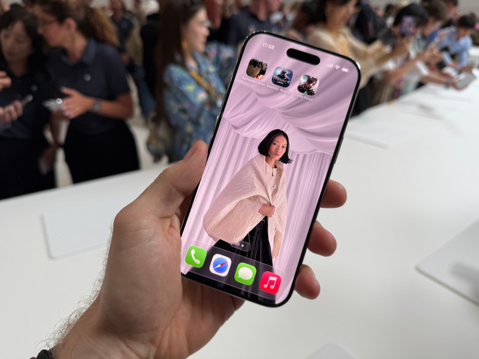 iPhone displaying fashion photo and game icons.