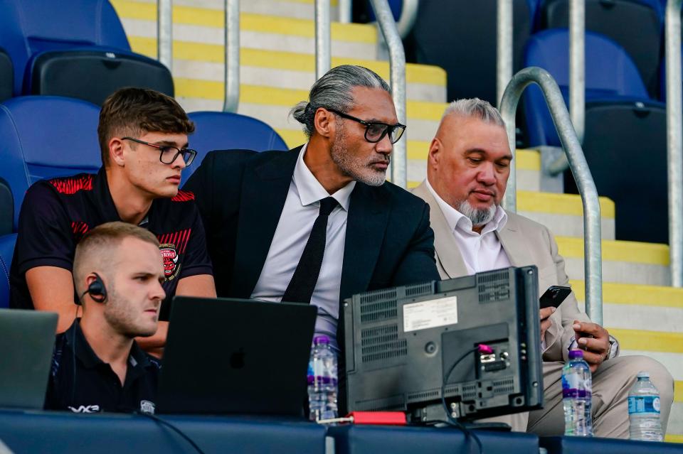 Two Salford owners, Dario Berta and Saia Kailahi, at a rugby match.