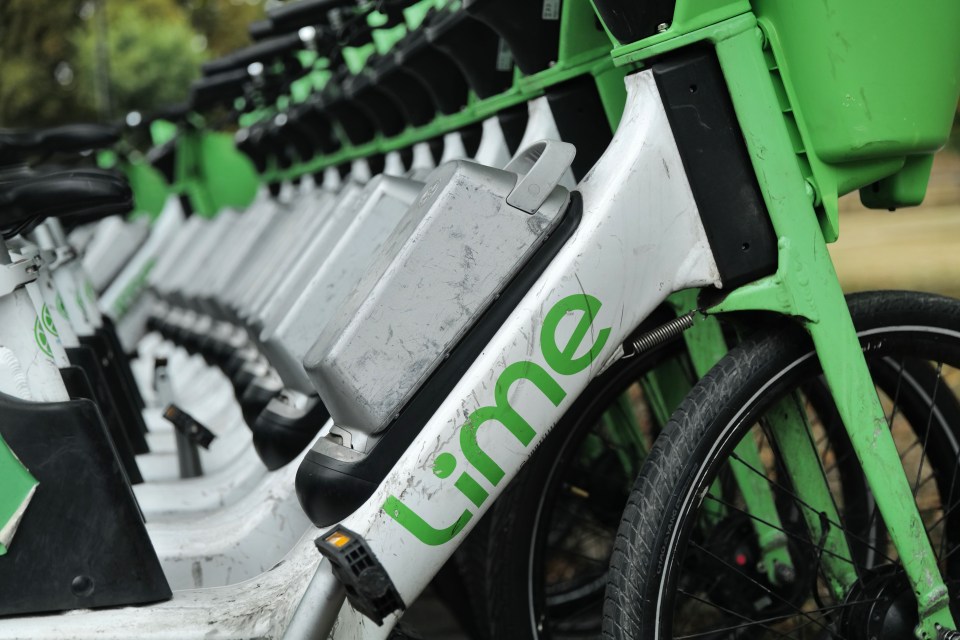 Lime bikes parked in a row.