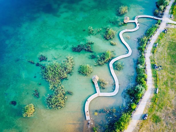 Turquiose Water and Wooden Bridge. Aerial Landscape. Park Grodek in Jaworzno, Poland.