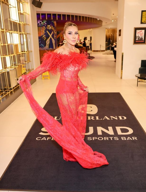 Narinder Kaur in a red dress.