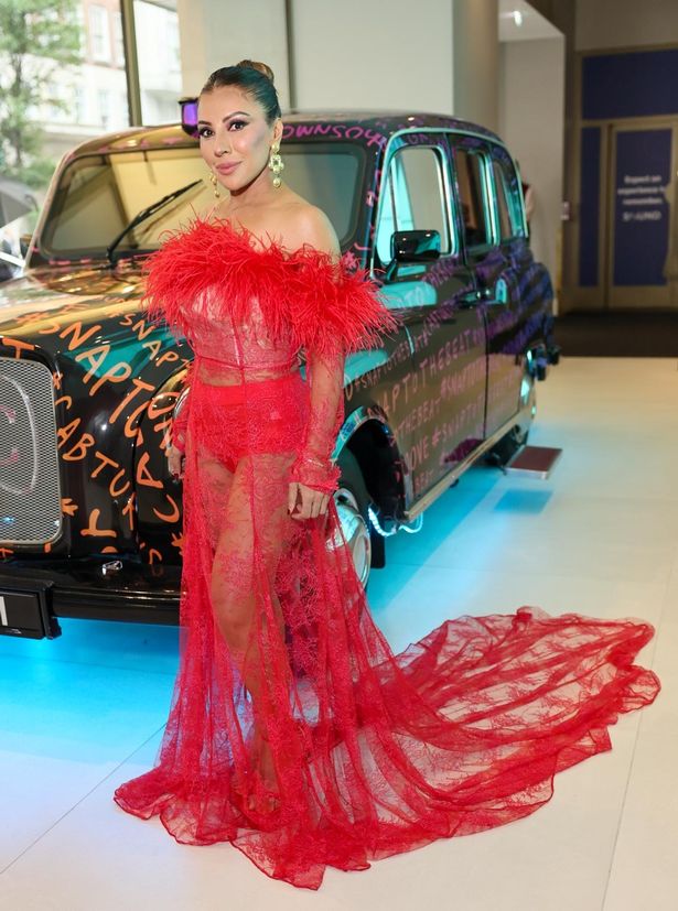 Narinder Kaur in a red dress.