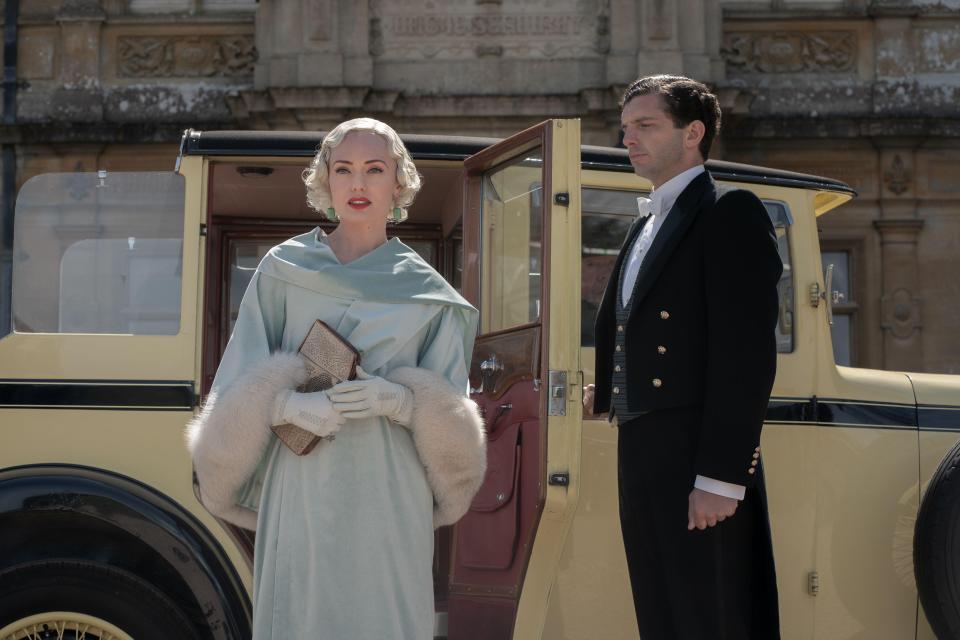 Still image from Downton Abbey: A New Era showing Laura Haddock and Michael Fox in period costume.