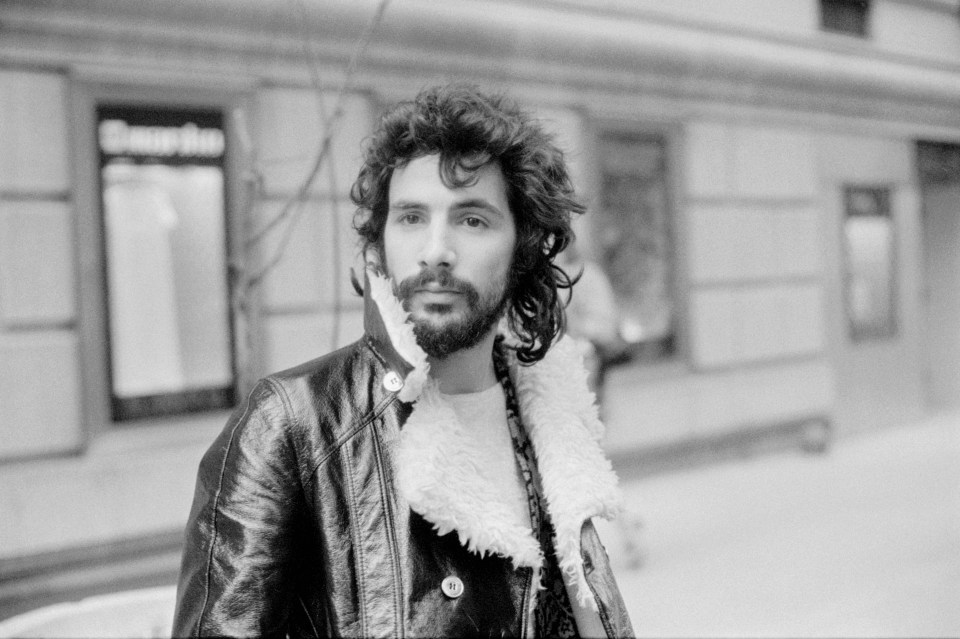 Black and white photo of Cat Stevens wearing a leather jacket.
