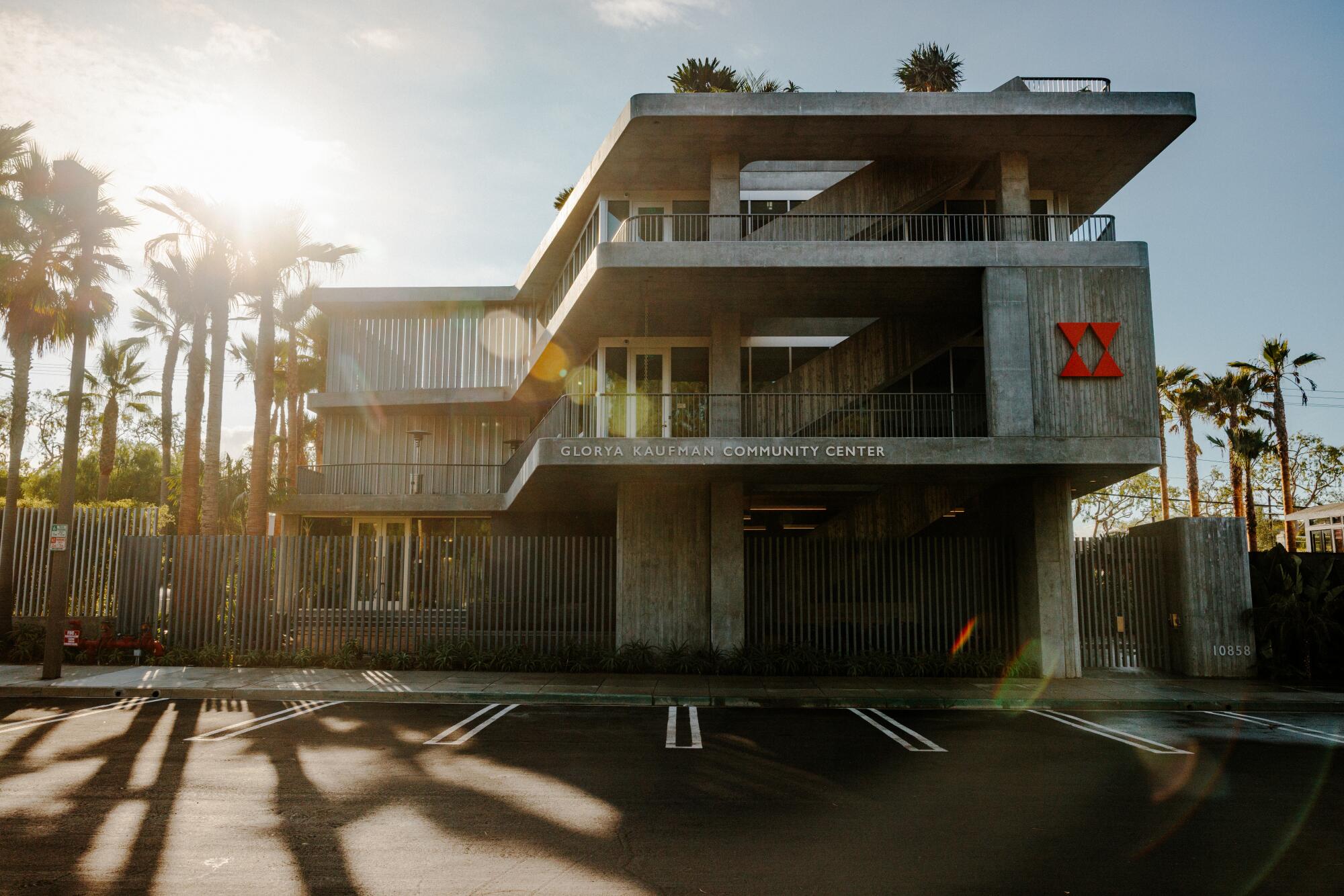 The modernist concrete building evokes Cold War–era architecture.