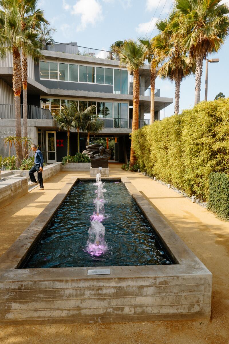 A concrete fountain in the sculpture garden.