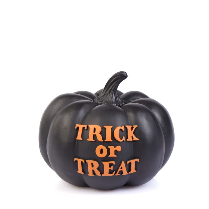 Black Halloween pumpkin with "Trick or Treat" in orange.