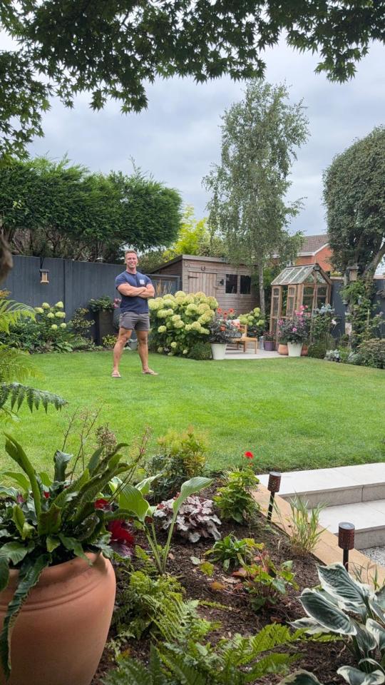 Man standing in his garden.