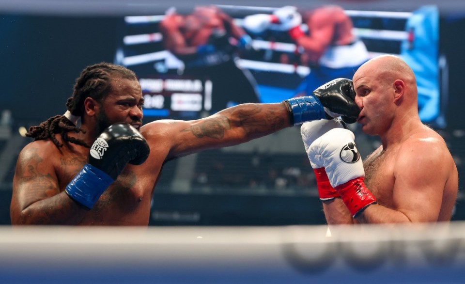 LAS VEGAS, NEVADA - SEPTEMBER 13: (L-R) Jermaine Franklin Jr. lands a left at Ivan Dychko during their heavyweight bout at Allegiant Stadium on September 13, 2025 in Las Vegas, Nevada. (Photo by Sarah Stier/Getty Images for Netflix)