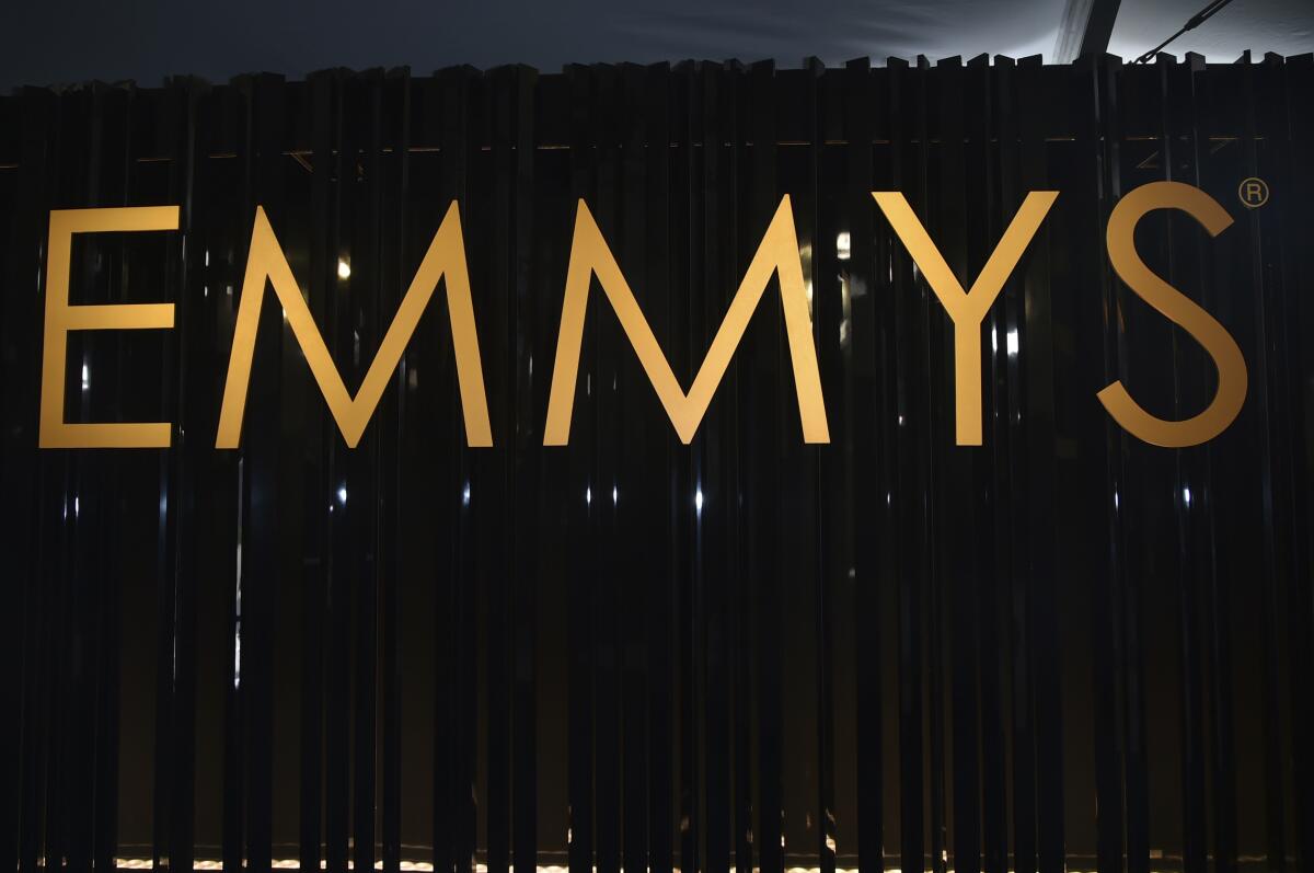 a sign that reads "Emmys"