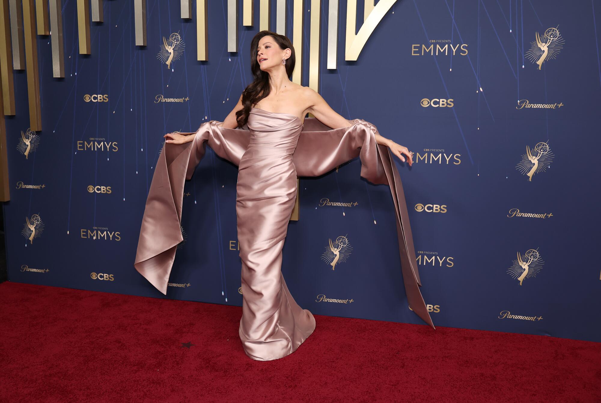 Jackie Tohn in a blush gown and dramatic shawl.