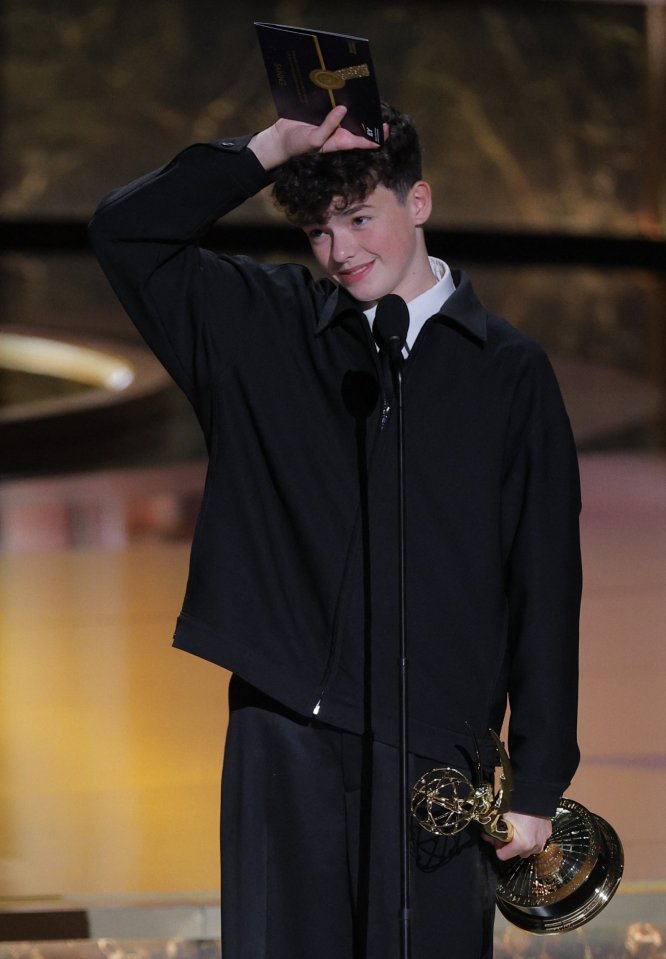 Owen Cooper accepting an Emmy award.