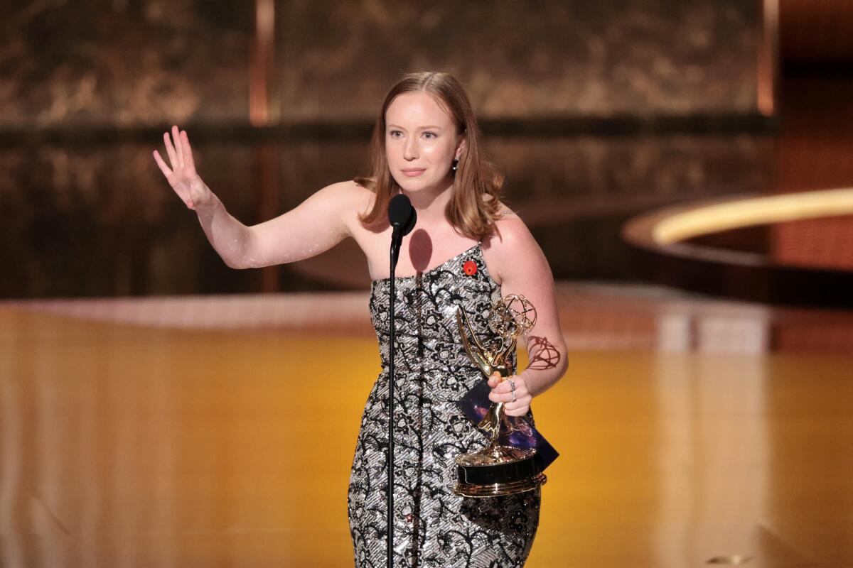A woman accepting an award.
