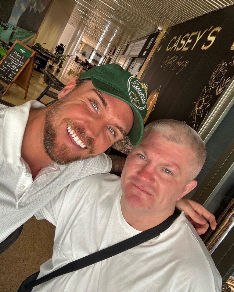 Photo of two men smiling together at Casey's Cocktail Lounge.