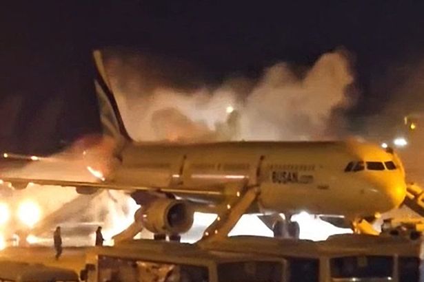 Image of workers extinguishing fire on Air Busan plane on January 28, 2025