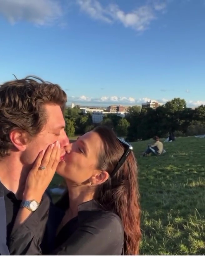 Marisa Abela and Jamie Bogyo kissing with an engagement ring visible on Abela's finger.