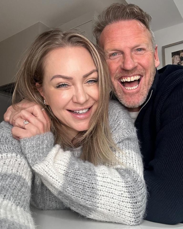 Rita Simons and Ben Jordan smiling, with Rita wearing an engagement ring.