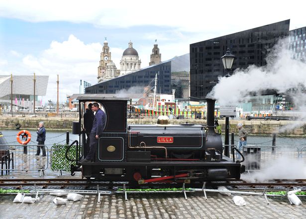 Image of the Ffestiniog & Welsh Highland Railways being driven along the Albert Dock in Liverpool