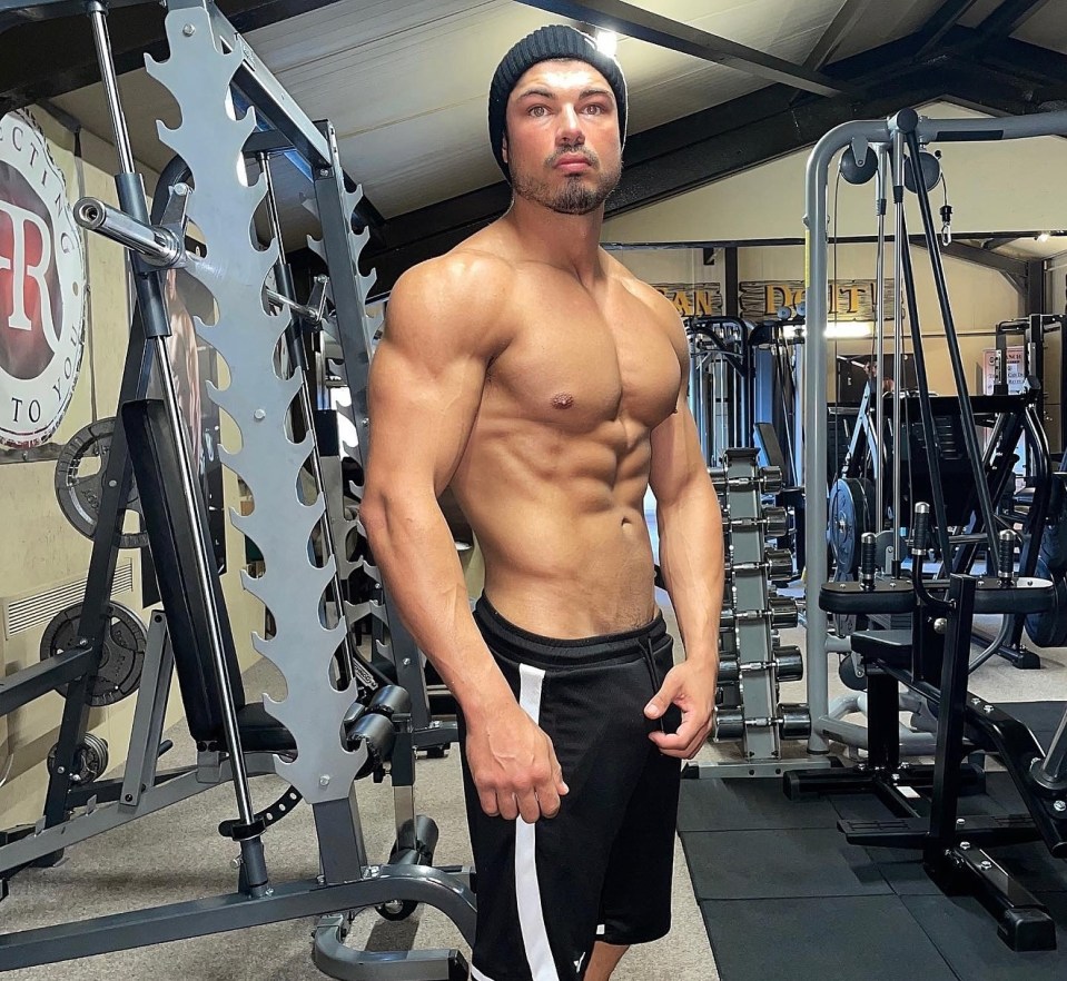 Anton Danyluk shirtless in a gym.