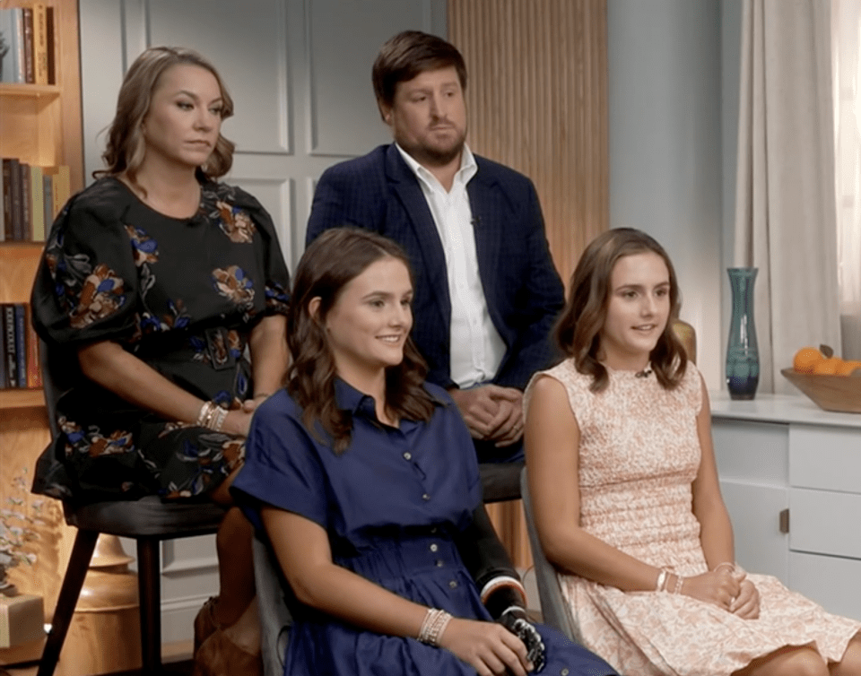 Lulu Gribbin with her family on Good Morning America, showing her prosthetic arm.