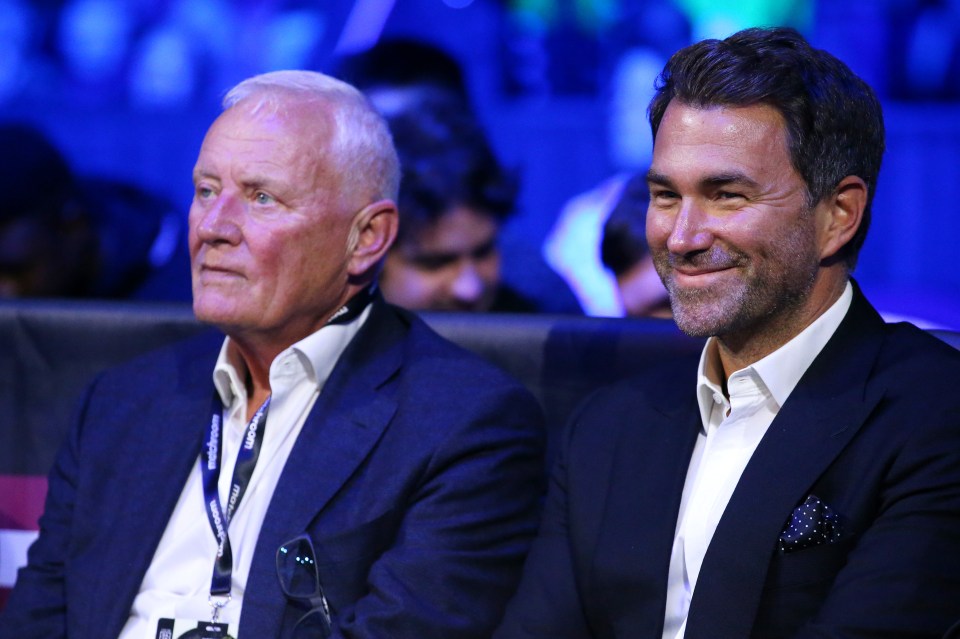Boxing promoter Eddie Hearn and his father Barry Hearn watching a boxing match.