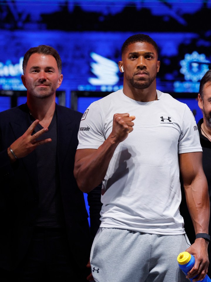 Boxer Anthony Joshua and promoter Eddie Hearn at a press conference.