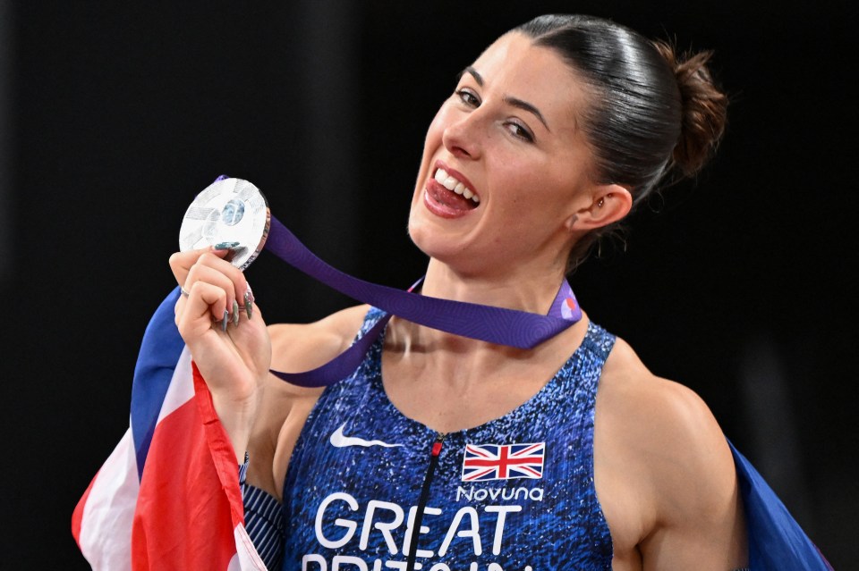 Amy Hunt celebrating with her silver medal in the women's 200m final.