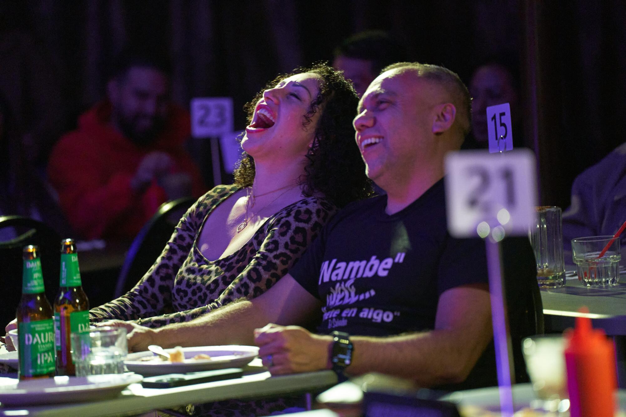 Patrons laugh during Pupusas and Punchlines on May 16, 2025.