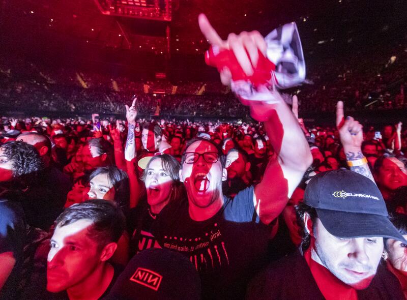 Fans react as Nine Inch Nails perform at Kia Forum.