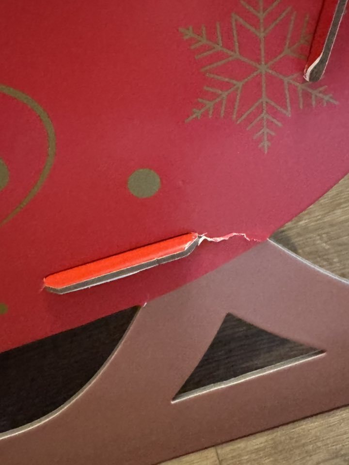 Broken Christmas cardboard decoration.