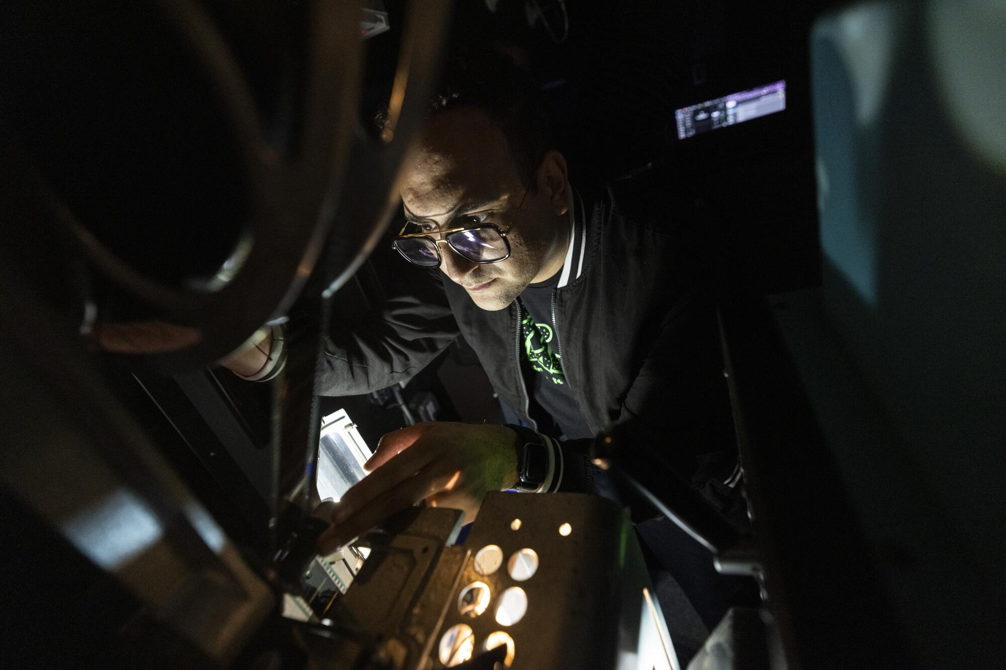 Vidiots technical director Boris Ibanez in the projection booth of Vidiots movie theater.