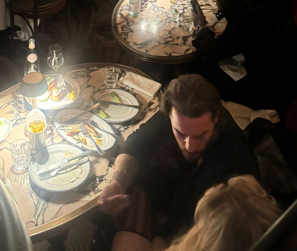 Pete Wicks kissing a blonde beauty at The Maine Mayfair restaurant.